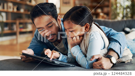 Home, hug and father with child for tablet, streaming games and bonding together with technology. Sofa, dad and love with girl for digital fun, entertainment and website with support in living room 124484328