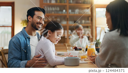 Family, parents and talking with child at lunch for bonding together, relationship and healthy meal. Love, home and happy people in dining room for social gathering, nutrition and relax with support 124484371