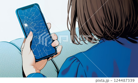 画面が激しく割れているスマートフォンを手にしているいる若い女性