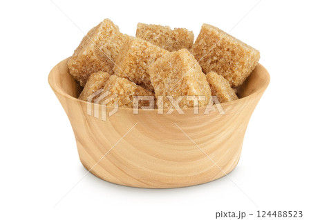 brown sugar in a wooden bowl isolated on white background brown sugar in a wooden bowl isolated on white background 124488523