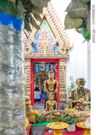 People pray respect to The Statue of buddha in Wat Chao Am, focus selective. People pray respect to The Statue of buddha in Wat Chao Am, focus selective. 124490650