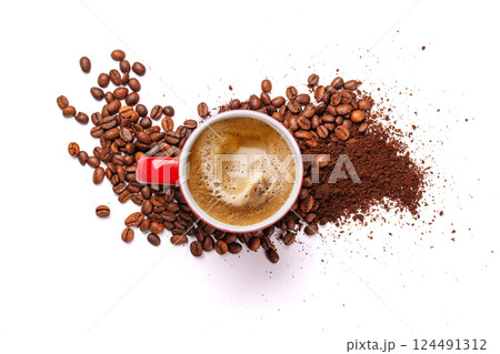 A steaming cup of freshly brewed coffee surrounded by rich, aromatic roasted coffee beans 124491312