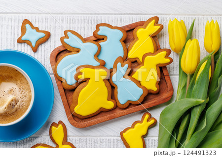 Easter Bunny-Shaped Gingerbread Cookies, Yellow Tulips, and Coffee Cup 124491323