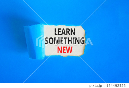 Learn something new symbol. Concept words Learn something new on beautiful white paper. Beautiful blue paper background. Business motivational lifestyle learn something new concept. Copy space. Learn something new symbol. Concept words Learn something new on beautiful white paper. Beautiful blue paper background. Business motivational lifestyle learn something new concept. Copy space. 124492523