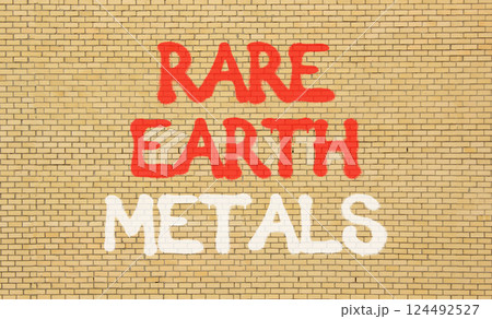 Rare earth metals symbol. Concept words Rare earth metals on beautiful brick wall . Beautiful brick wall background. Business and rare earth metals concept. Copy space. 124492527