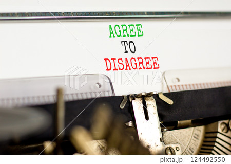 Agree to disagree symbol. Concept words Agree to disagree typed on beautiful old retro typewriter. Beautiful white paper background. Business and agree to disagree concept. Copy space. Agree to disagree symbol. Concept words Agree to disagree typed on beautiful old retro typewriter. Beautiful white paper background. Business and agree to disagree concept. Copy space. 124492550