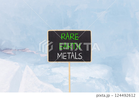 Rare earth metals symbol. Concept words Rare earth metals on beautiful blackboard. Beautiful blue ice and snow background. Business and rare earth metals concept. Copy space. Rare earth metals symbol. Concept words Rare earth metals on beautiful blackboard. Beautiful blue ice and snow background. Business and rare earth metals concept. Copy space. 124492612