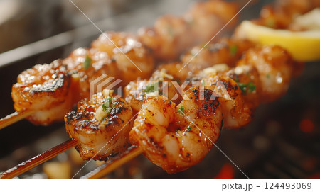 Grilled shrimp skewers with garlic and herbs on barbecue Grilled shrimp skewers with garlic and herbs on barbecue 124493069