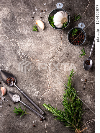 Rosemary, garlic, salt and pepper. Rosemary, garlic, salt and pepper. 124493977