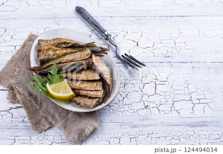 Canned smoked sprats in oil Canned smoked sprats in oil 124494034
