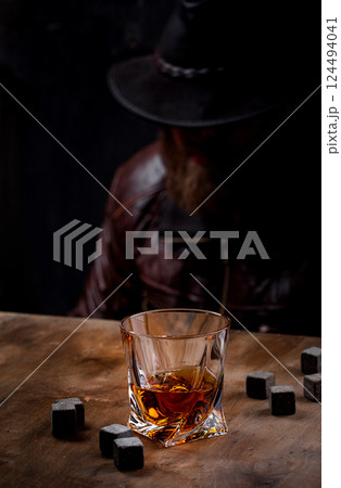 Glass of whiskey and stones Glass of whiskey and stones 124494041