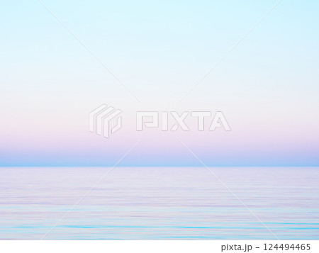 Pastel gradient sky and calm sea Pastel gradient sky and calm sea 124494465
