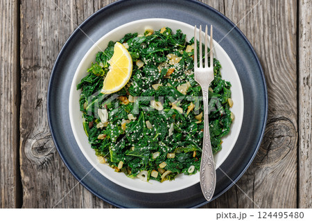 sauteed kale with garlic, onion, red pepper flakes sauteed kale with garlic, onion, red pepper flakes 124495480