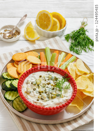 creamy yogurt pickles caper dill dip in red bowl 124495485