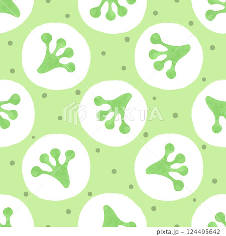 Seamless green polka dot pattern with frog footprints 124495642