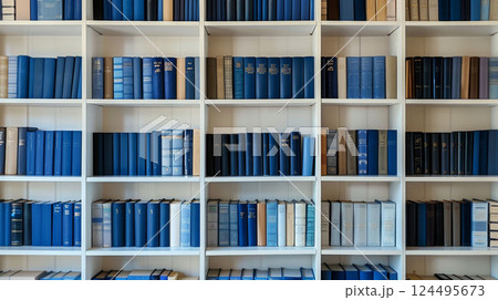 Wooden bookshelf with blue books, stylish library interior piece, warm and inviting home decor. 124495673