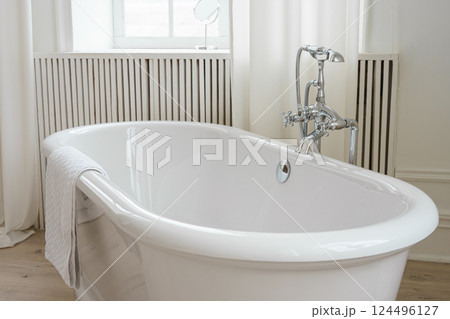 Modern elegant minimalist bathroom interior with curtains and window and freestanding bathtub Modern elegant minimalist bathroom interior with curtains and window and freestanding bathtub 124496127