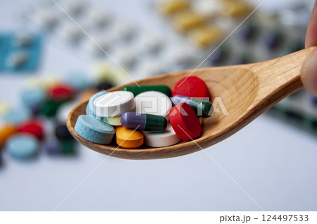 Close up of colorful pills or capsules with customizable space for text. Medical and health matters concept. 124497533