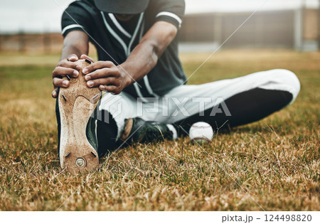 Baseball, player and stretching for game, training and workout on field, with ball and sportswear for health. Black man, athlete or doing exercise to prepare for game, match or fitness being healthy Baseball, player and stretching for game, training and workout on field, with ball and sportswear for health. Black man, athlete or doing exercise to prepare for game, match or fitness being healthy 124498820