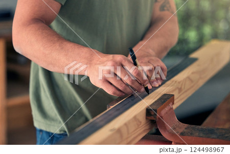 Man carpenter, measure wood for building and construction project for professional home renovation. Handyman, measuring wooden beam and marking measurements with pen for creating decoration for house Man carpenter, measure wood for building and construction project for professional home renovation. Handyman, measuring wooden beam and marking measurements with pen for creating decoration for house 124498967