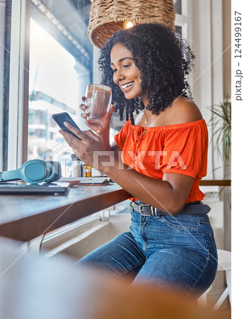 Phone, coffee and woman on social media at a cafe relaxing while enjoying trendy news and online content. Smile, entertainment and happy girl reading posts on a social networking app in a restaurant Phone, coffee and woman on social media at a cafe relaxing while enjoying trendy news and online content. Smile, entertainment and happy girl reading posts on a social networking app in a restaurant 124499167