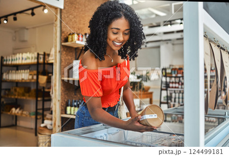 Shopping, supermarket and customer with product in groceries freezer for food choice, store sale or price check. Commerce, retail and grocery of black woman in eco friendly shop happy with decision Shopping, supermarket and customer with product in groceries freezer for food choice, store sale or price check. Commerce, retail and grocery of black woman in eco friendly shop happy with decision 124499181