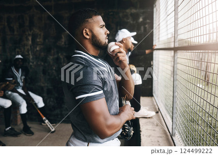 Baseball, man and watching game with a ball in a sports dugout with his team in club uniform. Latino men watch baseball game on the bench together or waiting to start training, workout or practice 124499222