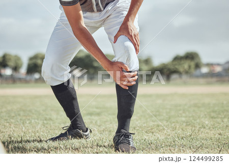 Baseball leg injury, man and sports athlete on a outdoor grass field hurt in the summer. Baseball player experience a muscle pain from workout exercise, fitness and cardio game training accident 124499285