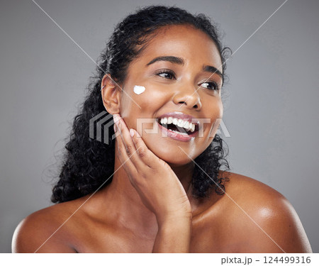 Cosmetics, black woman and cream with smile, wellness and health for natural beauty, happy and grey studio background. Makeup, healthy girl and skincare for organic facial, smooth skin and body care. Cosmetics, black woman and cream with smile, wellness and health for natural beauty, happy and grey studio background. Makeup, healthy girl and skincare for organic facial, smooth skin and body care. 124499316