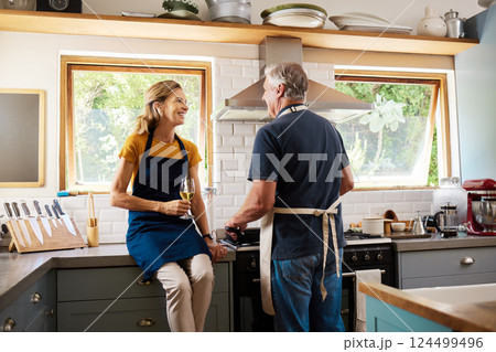 Retirement, senior couple and cooking in kitchen have discussion, talking or loving prepare meal together. Love, mature man and elderly woman is romantic, happy and smile to enjoy anniversary at home Retirement, senior couple and cooking in kitchen have discussion, talking or loving prepare meal together. Love, mature man and elderly woman is romantic, happy and smile to enjoy anniversary at home 124499496