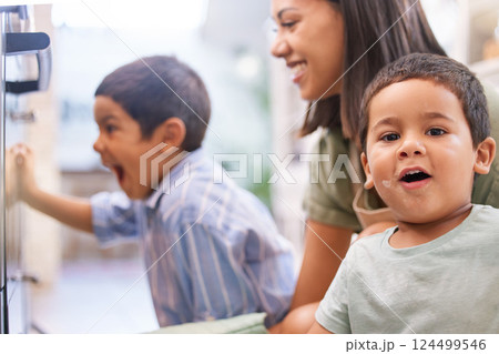 Mom, kids and oven in kitchen for baking, cooking or cake in home with happy, excited and smile on face. Mother, boy and children in house for preparation of cookies, food or muffin in Los Angeles Mom, kids and oven in kitchen for baking, cooking or cake in home with happy, excited and smile on face. Mother, boy and children in house for preparation of cookies, food or muffin in Los Angeles 124499546
