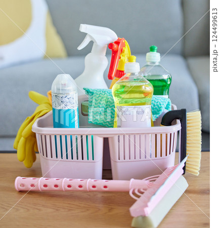 Cleaning service, product basket cleaner on living room table with home, house or lounge advertising and marketing career job. Liquid, detergent and dish water in plastic spray bottle for lounge room Cleaning service, product basket cleaner on living room table with home, house or lounge advertising and marketing career job. Liquid, detergent and dish water in plastic spray bottle for lounge room 124499613