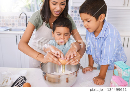 Mom, kids and kitchen for baking, cooking or cake in home while excited, happy or smile on face. Mother, boy and children in house to crack egg for learning of food, cookies or muffins in Los Angeles Mom, kids and kitchen for baking, cooking or cake in home while excited, happy or smile on face. Mother, boy and children in house to crack egg for learning of food, cookies or muffins in Los Angeles 124499631