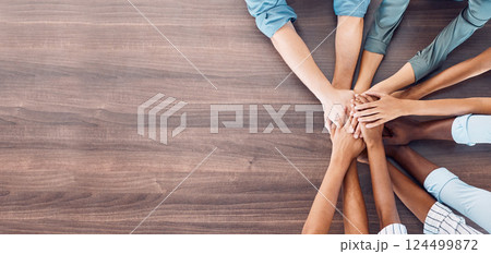 Team, hands and solidarity on table for mockup in office for teamwork, motivation and goal in business. Group, workers and hand together in closeup with copy space for advertising on desk in stack Team, hands and solidarity on table for mockup in office for teamwork, motivation and goal in business. Group, workers and hand together in closeup with copy space for advertising on desk in stack 124499872