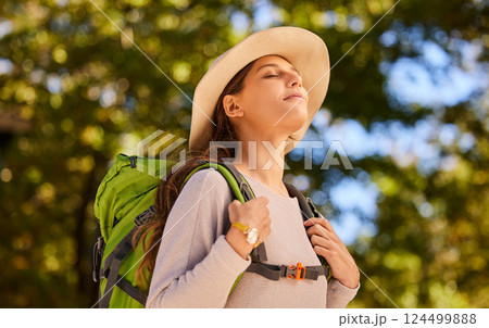 Woman, breath and backpacking in nature travel for calm, peaceful and relaxing adventure. Relaxed female traveler enjoying fresh air, trip and exploring the outdoors for health, fitness or hiking day 124499888