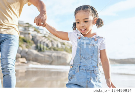 Beach, holding hands and child walking outdoor in sunshine for summer, holiday travel or vacation with family or father support, help and love. Girl kid, parent and ocean or sea water fun bonding Beach, holding hands and child walking outdoor in sunshine for summer, holiday travel or vacation with family or father support, help and love. Girl kid, parent and ocean or sea water fun bonding 124499914