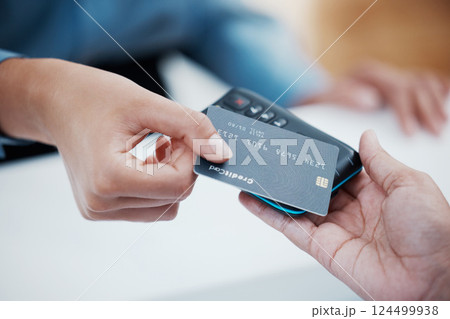 Credit card, payment and nfc with the hand of a customer scanning a chip for a purchase in a retail store. Finance, money and fintech with a consumer paying using wireless technology for shopping 124499938