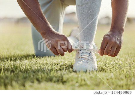 Baseball field, man and shoes lace tie for sports match with professional game uniform for pitch. Baseball, start and athlete male footwear preparation for sport competition tournament on grass. 124499969