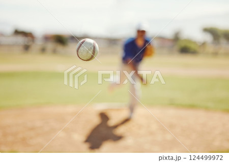Sports, pitch and baseball ball in air, pitcher throwing it in match, game or practice in outdoor field. Fitness, exercise and training on baseball field with player in action, movement and motion 124499972