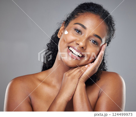 Woman, skincare cream and face portrait, sunscreen makeup product and luxury beauty cosmetics for wellness on studio background. Happy indian model, facial spf lotion or natural aesthetic dermatology Woman, skincare cream and face portrait, sunscreen makeup product and luxury beauty cosmetics for wellness on studio background. Happy indian model, facial spf lotion or natural aesthetic dermatology 124499973