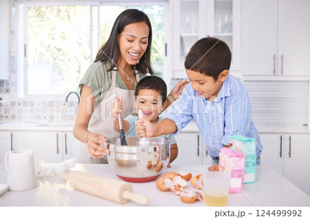 Baking, kids and mom in the home kitchen cooking food with a boy and baby with happiness. Family, mother and happy children smile at a house teaching with ingredients together smiling in family home 124499992