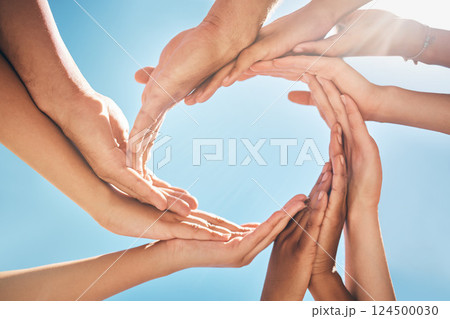 Circle, support and hands of friends for community, collaboration and trust against a blue sky. Group of people in nature helping the environment, giving hope and in solidarity as team during summer 124500030