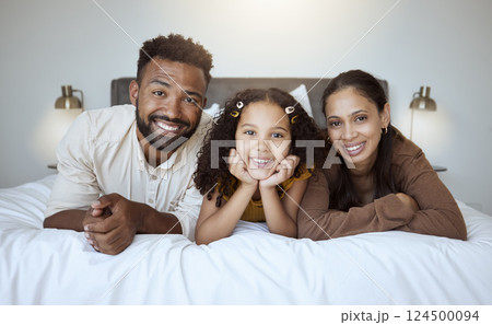 Black family bed, bonding and love of a mother, father and girl on a home bedroom together. Portrait of a happy mama, dad and child in the morning feeling happiness smile feeling care in a house Black family bed, bonding and love of a mother, father and girl on a home bedroom together. Portrait of a happy mama, dad and child in the morning feeling happiness smile feeling care in a house 124500094