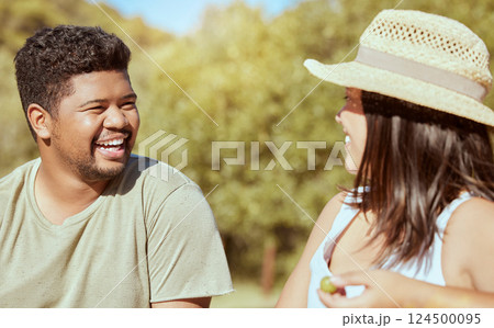 Happy, love and couple in nature in a conversation while on an outdoor garden picnic date in summer. Happiness, communication and young man and woman with a smile talking in a park to relax together. Happy, love and couple in nature in a conversation while on an outdoor garden picnic date in summer. Happiness, communication and young man and woman with a smile talking in a park to relax together. 124500095