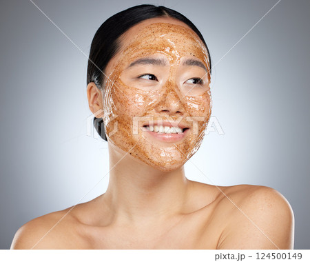 Exfoliate face mask for beauty skincare, natural product for healthy skin and clean cosmetic wellness for body against grey mockup studio background. Happy, smile and healthcare on Asian woman model Exfoliate face mask for beauty skincare, natural product for healthy skin and clean cosmetic wellness for body against grey mockup studio background. Happy, smile and healthcare on Asian woman model 124500149