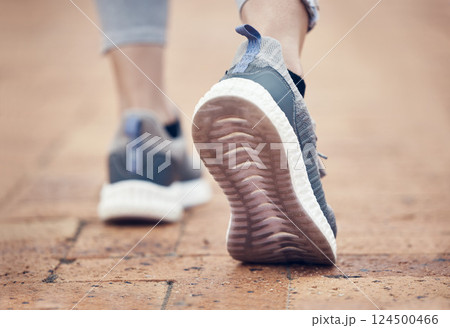 Runner, shoes and outdoor walk of a woman feet before fitness, workout and running exercise. Sport training, foot walking and healthy cardio of a person on a brick pavement ready for a sports run 124500466