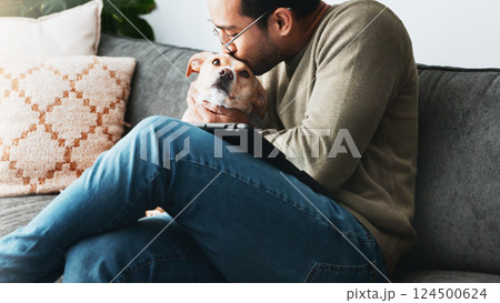 Kiss, man and love for dog in home with care, loyalty and bonding together as friends or companion. Pet animal, connection or person in living room on sofa for support, affection or relax with tablet Kiss, man and love for dog in home with care, loyalty and bonding together as friends or companion. Pet animal, connection or person in living room on sofa for support, affection or relax with tablet 124500624