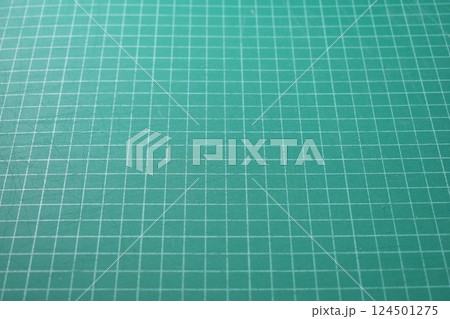 green cutting mat board background with line and scale measure guide pattern for art design green cutting mat board background with line and scale measure guide pattern for art design 124501275