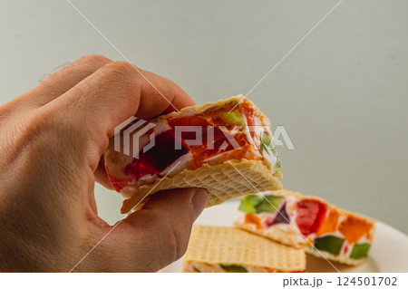 Enjoying delicious jelly waffle cakes with fresh fruits Enjoying delicious jelly waffle cakes with fresh fruits 124501702