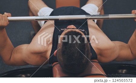 An Arab man pumps his chest in the gym. An Arab man pumps his chest in the gym. 124503572
